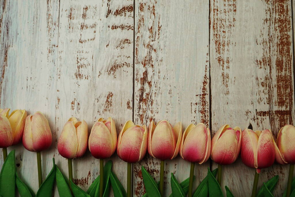 Pink Tulips bouquet with Space for texton a wooden background - Zdjęcie, obraz
