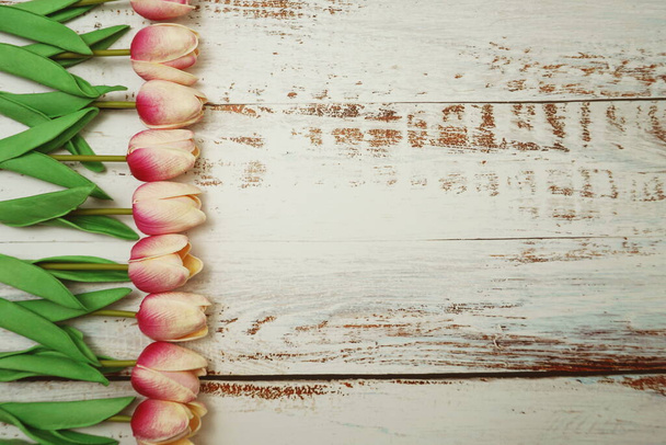 Pink Tulips bouquet with Space for texton a wooden background - Photo, image