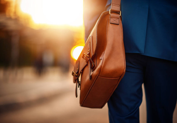 Close up of a businessman holding his briefcase.Business and travel concept. - Foto, imagen