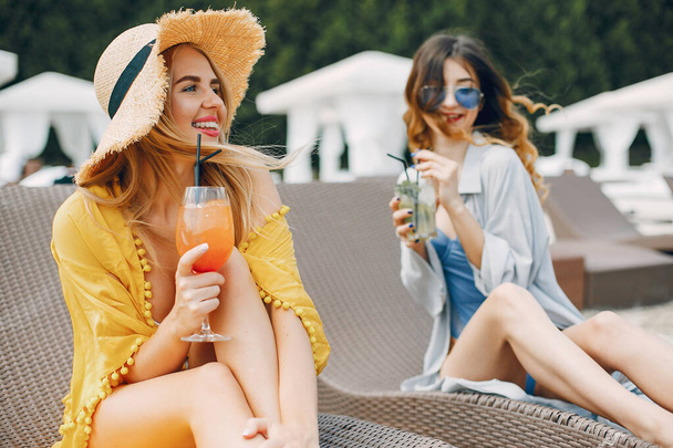 Two elegant girls on a resort - Photo, image