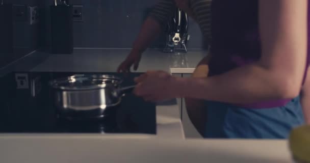 Mother and baby turning on cooker - Footage, Video