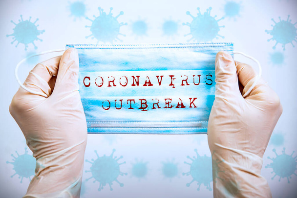 Concept of COVID-19 - Coronavirus disease - 2019-nCoV. Medical Disposable Face Mask with covid-19 printed on it.  - Foto, Imagen