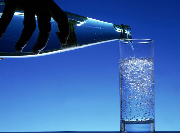 Bottle and Glass of Sparkling Water    - Fotoğraf, Görsel