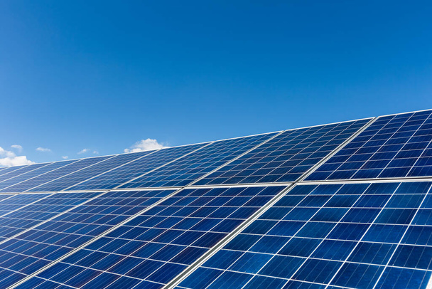 solar panels against a blue sky with clipping path - Photo, Image