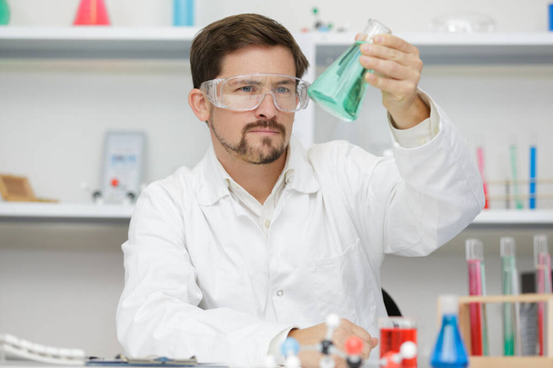 a male worker reseacher in a laboratory - Photo, image