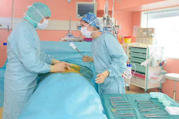 two surgeon in operating room - 写真・画像