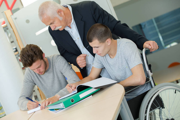 young handicapped students sitting on wheelchair - Foto, Bild