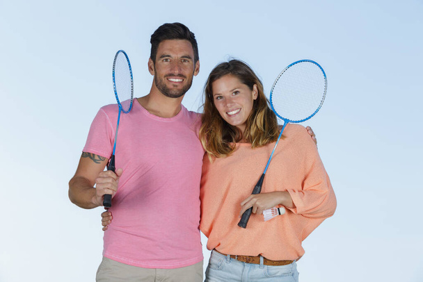 couple after playing badminton outdoors - Fotografie, Obrázek
