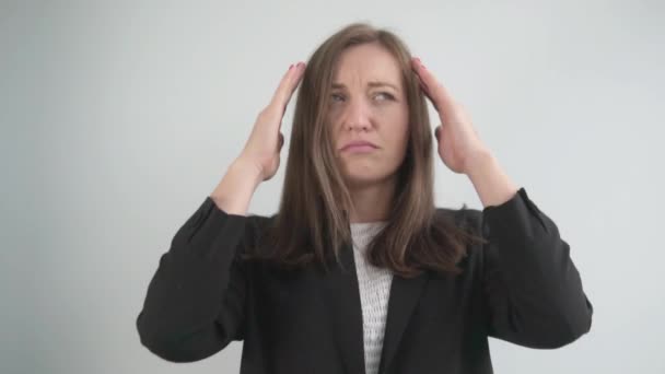 Businesswoman with headache rubs fingers of the temple - Кадри, відео