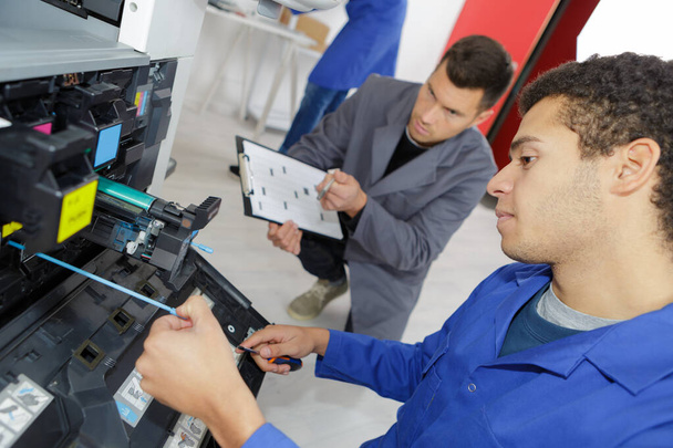 man repairing printer in professional school - Photo, Image