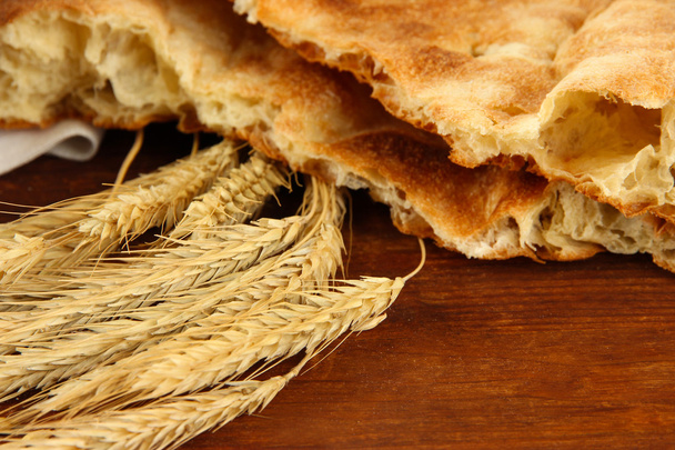 Pita breads with spikes on table close up - Foto, imagen