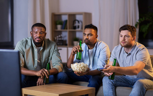 male friends with beer watching tv at home - Fotoğraf, Görsel