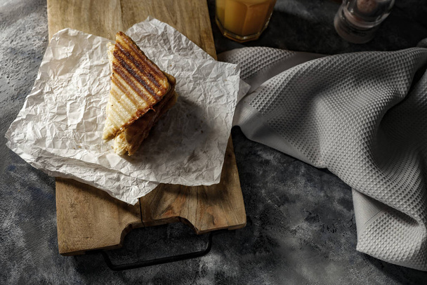 Toasts and sandwiches and breakfast time. Copy space for your product and dark mood background. - Photo, Image