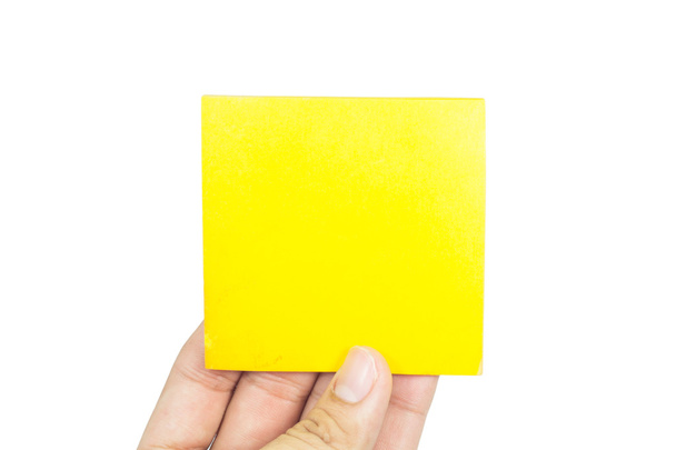 izole sarı kağıt tutan el - Fotoğraf, Görsel