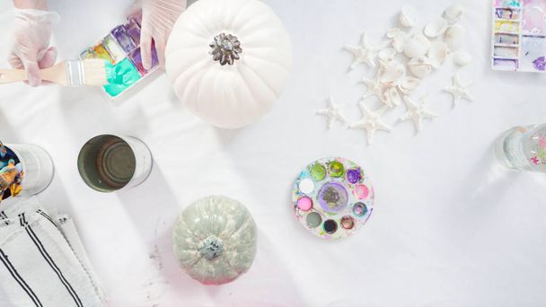 Flat lay. Step by step. Painting craft pumpkin with acrylic paint to create decorated mermaid Halloween pumpkin. - Fotografie, Obrázek