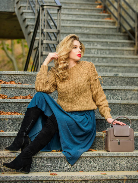 perfect female. female beauty. Fashion model. girl in corrugated skirt and sweater. Pleated trend. autumn woman curly hair outdoor. girl long blond hair stairs. casual style student. fall season - Фото, изображение