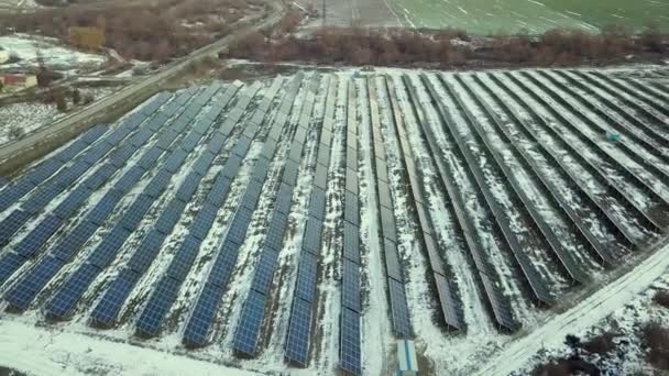 Blue solar photo voltaic panels system producing renewable clean energy in rural area in winter. - Footage, Video