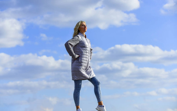 sense of freedom. future and success. lifestyle concept. trendy girl in casual fall coat. autumn and spring style. Young and beautiful woman over sky background. above the clouds. looking far away - Foto, afbeelding