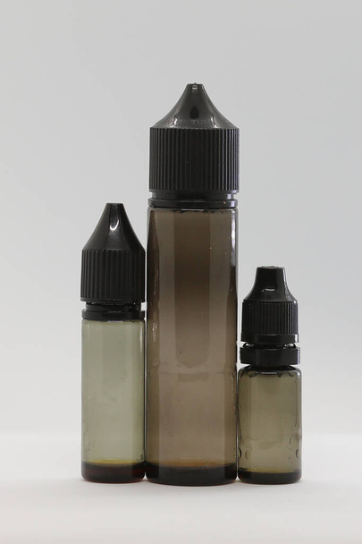 Vaping e-liquid juice bottles for electronic cigarette companies and shops. electronic cigarette liquid - Photo, Image