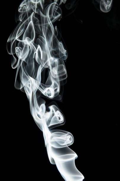 Abstract shape of white smoke on black background. - Foto, Imagen