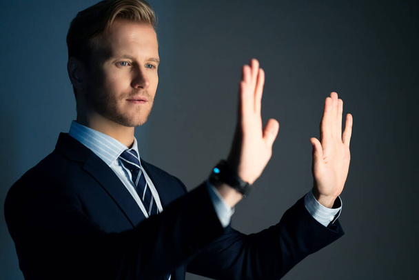 smart caucasian businessman formal suit portrait half body hand touch copy space with dark color background - Foto, Imagen