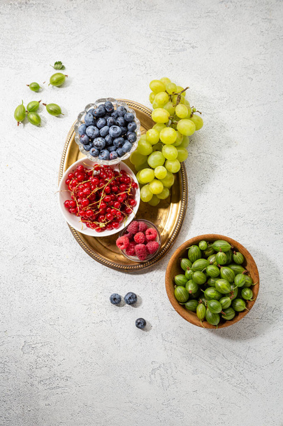 Summer berries and green grapes - Фото, зображення