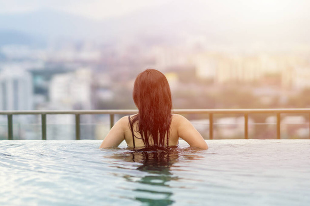 Travel Concept, Swimming pool on roof top with beautiful city view Kuala Lumpur malaysia - 写真・画像