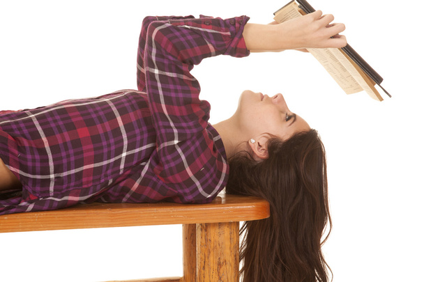 Woman close lay on back reading - Foto, afbeelding
