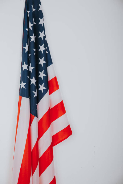 Close-up of American flag on white background. - Zdjęcie, obraz