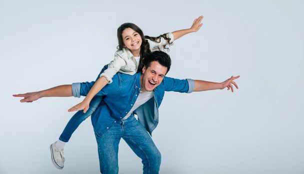 happy father and daughter hugging on white background - Foto, Imagen