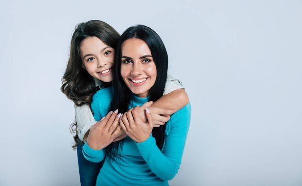 happy mother and daughter hugging and smiling  - Foto, Imagem