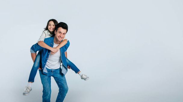 happy father and daughter hugging on white background - Photo, Image