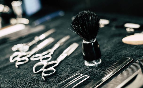 brushes and professional tools on the table, barbershop  - Fotografie, Obrázek