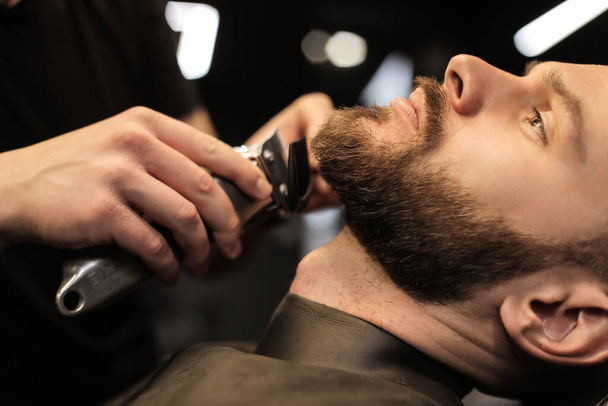 handsome young man in barber shop  - Fotografie, Obrázek