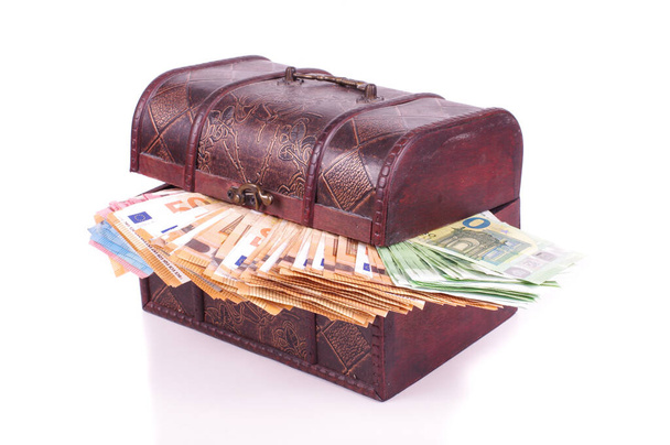 Many euro banknotes in the old retro chest isolated on the white background - Photo, Image