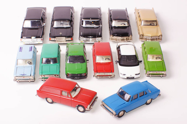Collection of vintage metal die-cast car models isolated on the white background - Foto, afbeelding