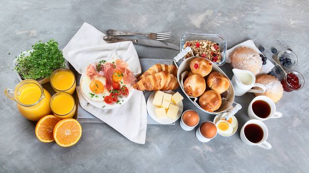 Healthy breakfast ingredients on gray background. Top view, flat lay - Fotografie, Obrázek