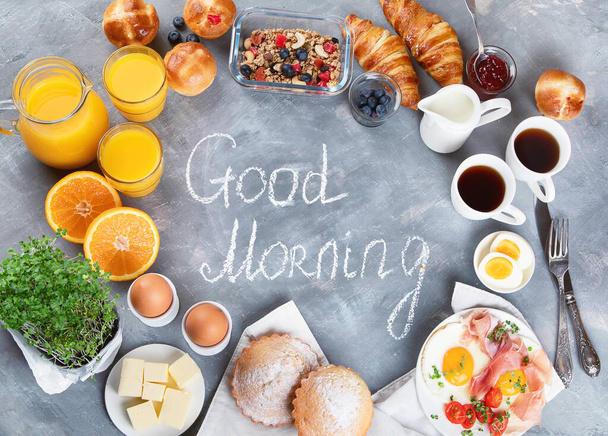 Healthy breakfast ingredients on gray background. Top view with copy space - Zdjęcie, obraz
