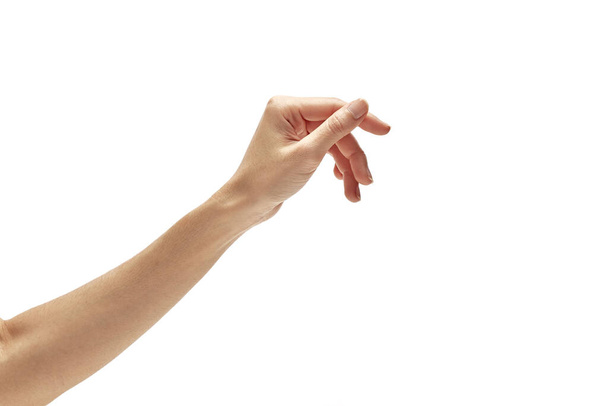 Пустой открытой азиатской женщины рука тянется к получить что-то изолированное на белом фоне
 - Фото, изображение