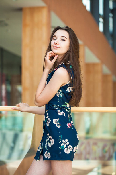 Close up portrait of a young beautiful brunette model in blue dress - Foto, imagen