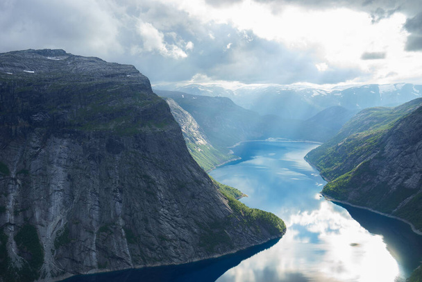 Beautiful fjord in Norway with amazing sun rays. View from the top - Photo, Image