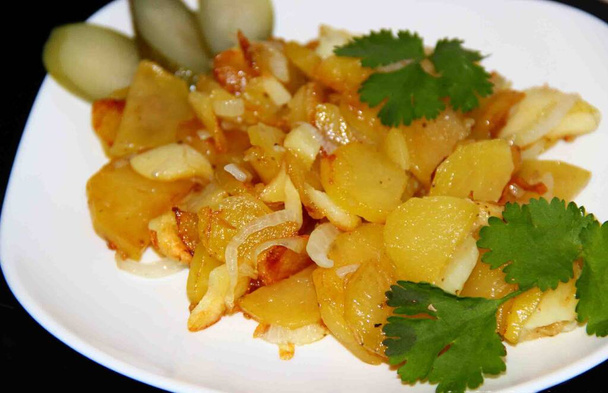 Homemade Fried potatoes with onions on a white plate - Fotoğraf, Görsel