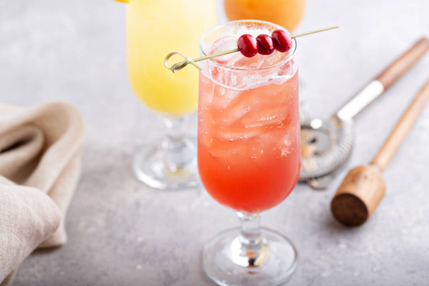Refreshing cocktails or mocktails with oranges and cranberries - Fotoğraf, Görsel