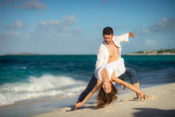 loving couple dancing at sand on sea beach at summer against waves surf - Foto, Imagem