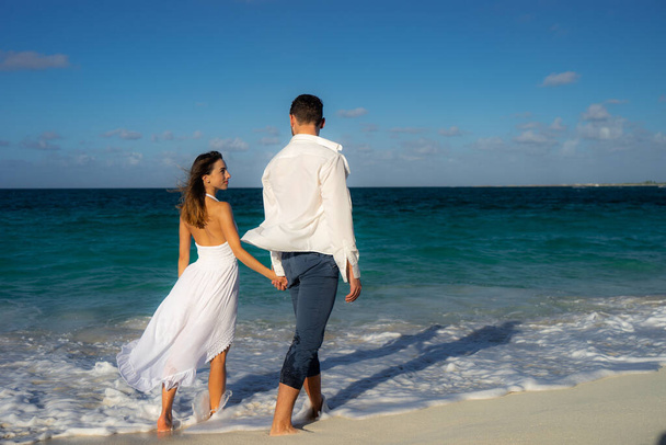 loving couple dancing at sand on sea beach at summer against waves surf - Foto, imagen