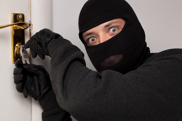 Thief Burglar opening door - 写真・画像