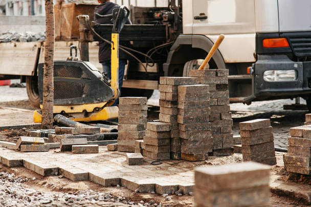 the process of laying paving slabs in the city - Photo, Image