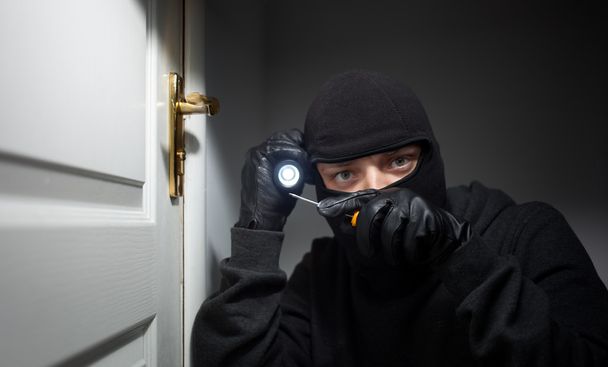 Thief Burglar opening door - Foto, Bild