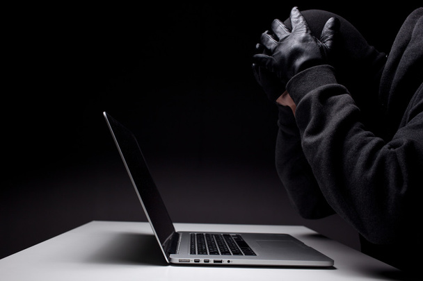 Computer hacker in a balaclava - Фото, зображення