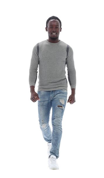 in full growth. smiling young man in fashionable jeans - Photo, Image